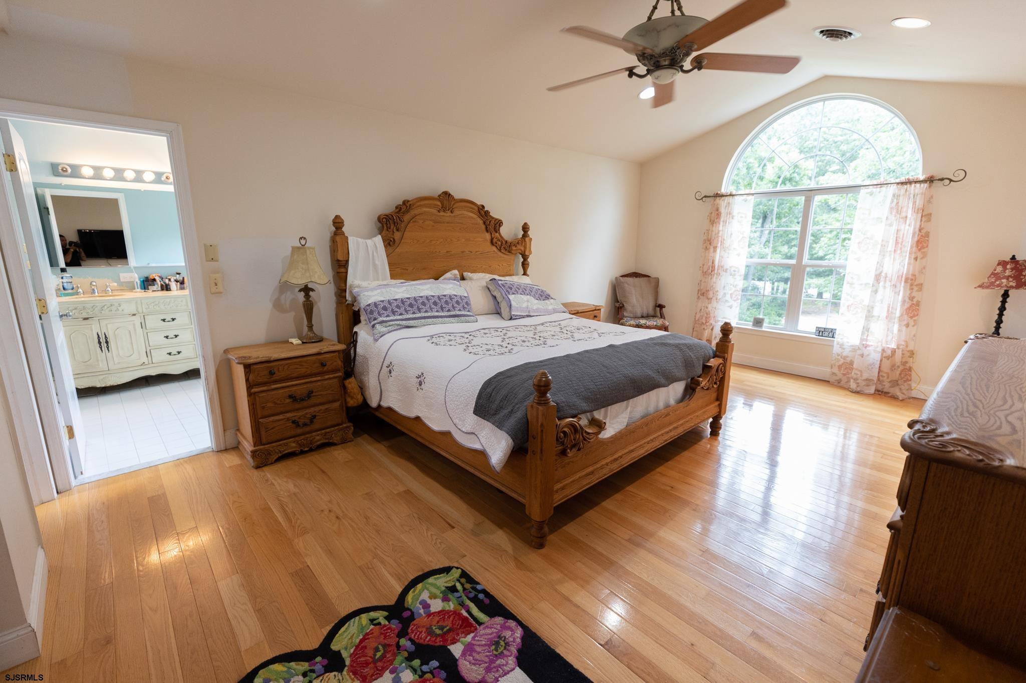 336 Old New York Road Port Republic, NJ 08241 - Photo 17 of 42 a bedroom with a bed a window and a flat screen tv