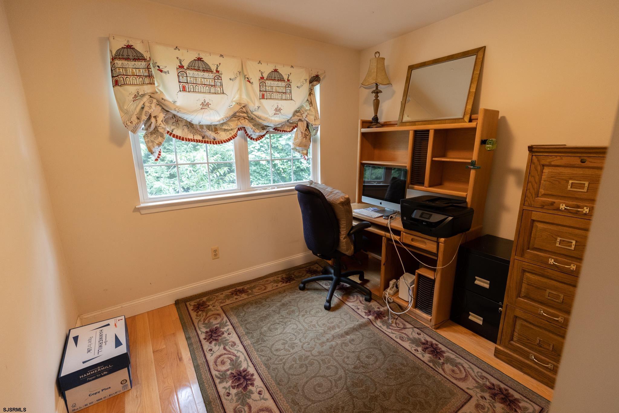 336 Old New York Road Port Republic, NJ 08241 - Photo 22 of 42 a view of a workspace with furniture and a window