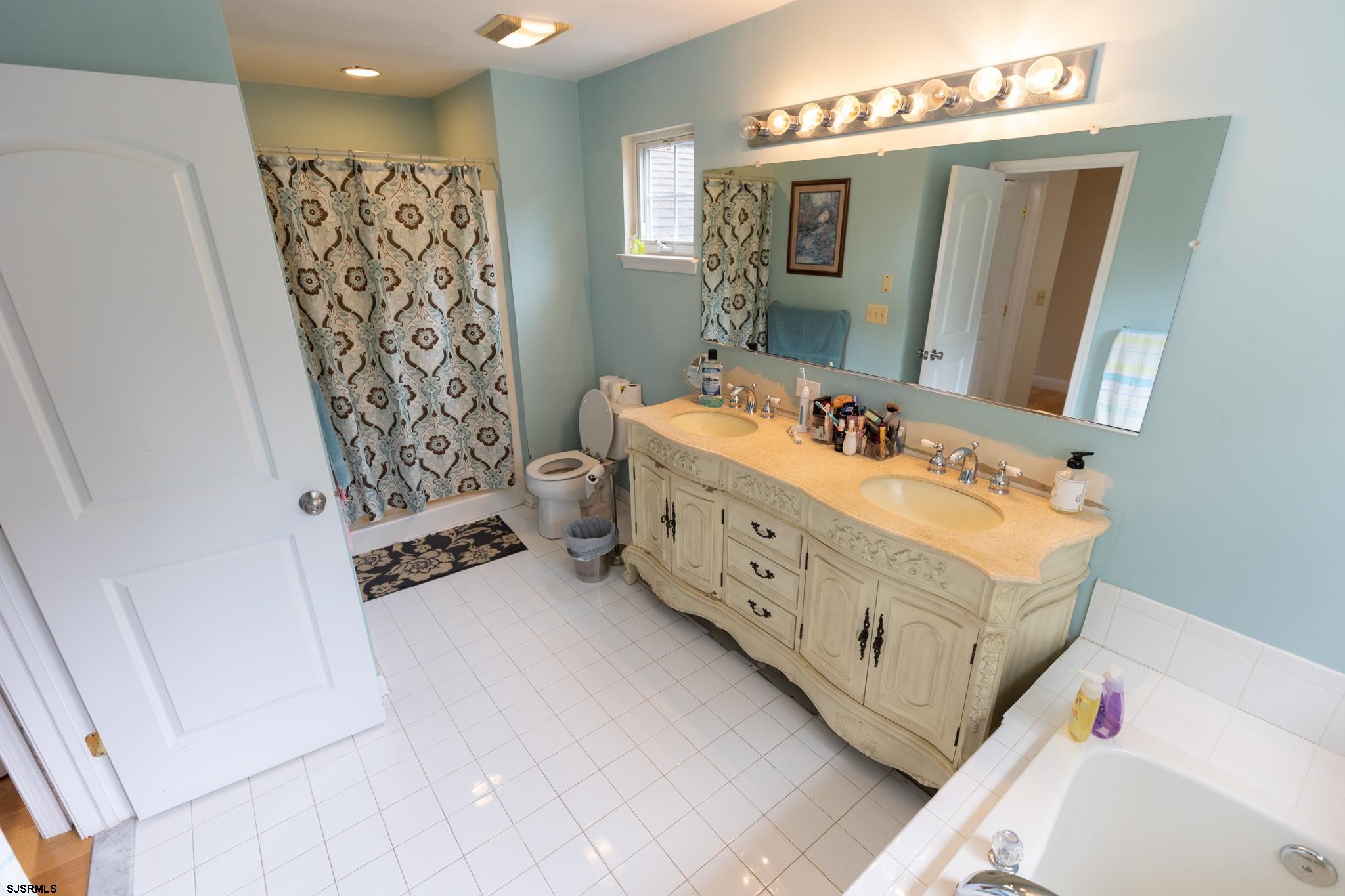 336 Old New York Road Port Republic, NJ 08241 - Photo 25 of 42 a bathroom with a double vanity sink mirror and shower