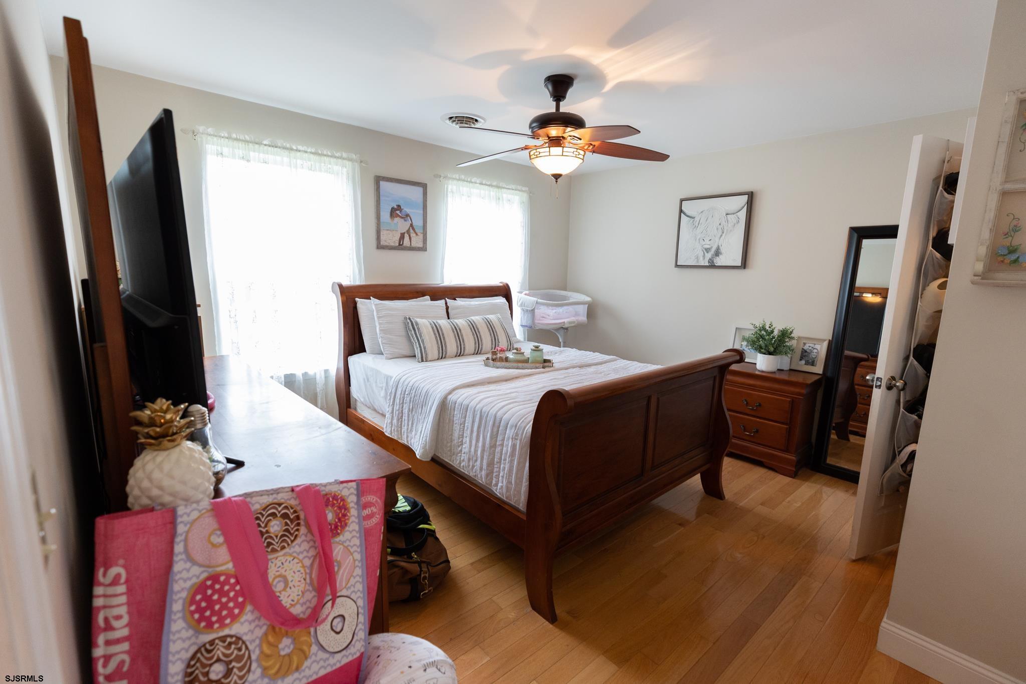 336 Old New York Road Port Republic, NJ 08241 - Photo 28 of 42 a bedroom with a bed and a flat tv screen on a dresser