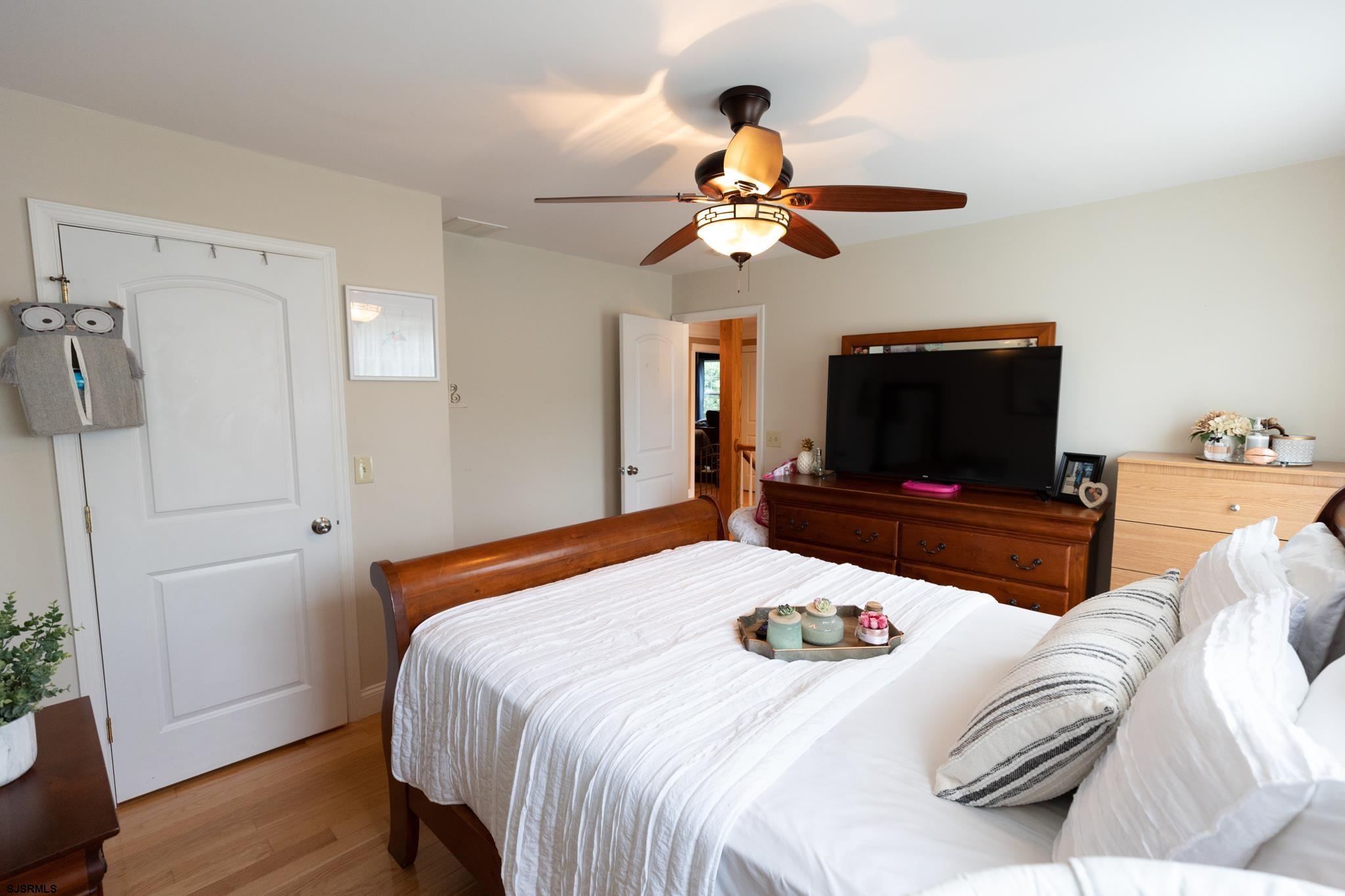 336 Old New York Road Port Republic, NJ 08241 - Photo 29 of 42 a bedroom with a bed and a flat screen tv