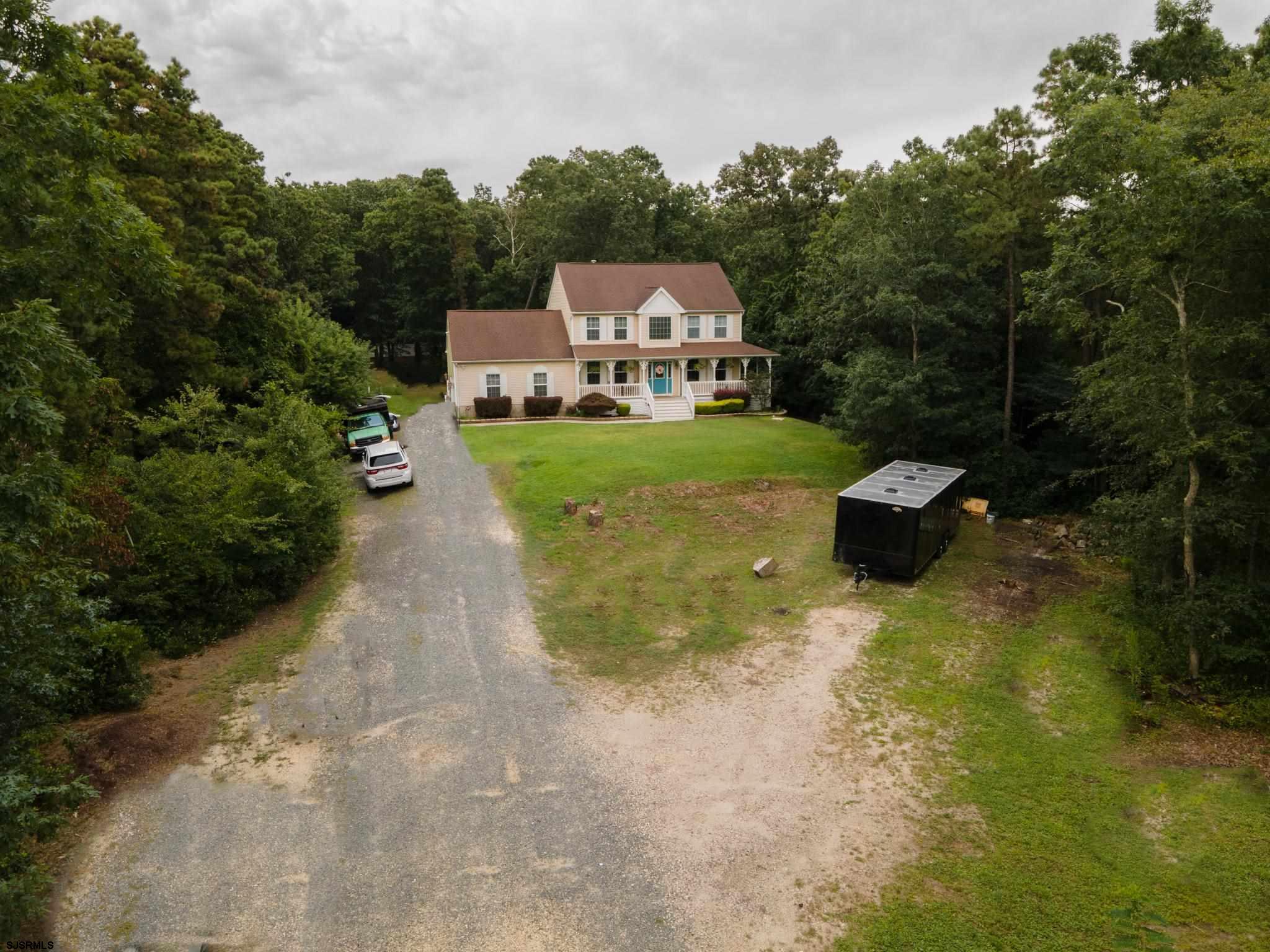 336 Old New York Road Port Republic, NJ 08241 - Photo 35 of 42 a view of a big house with a yard and large trees