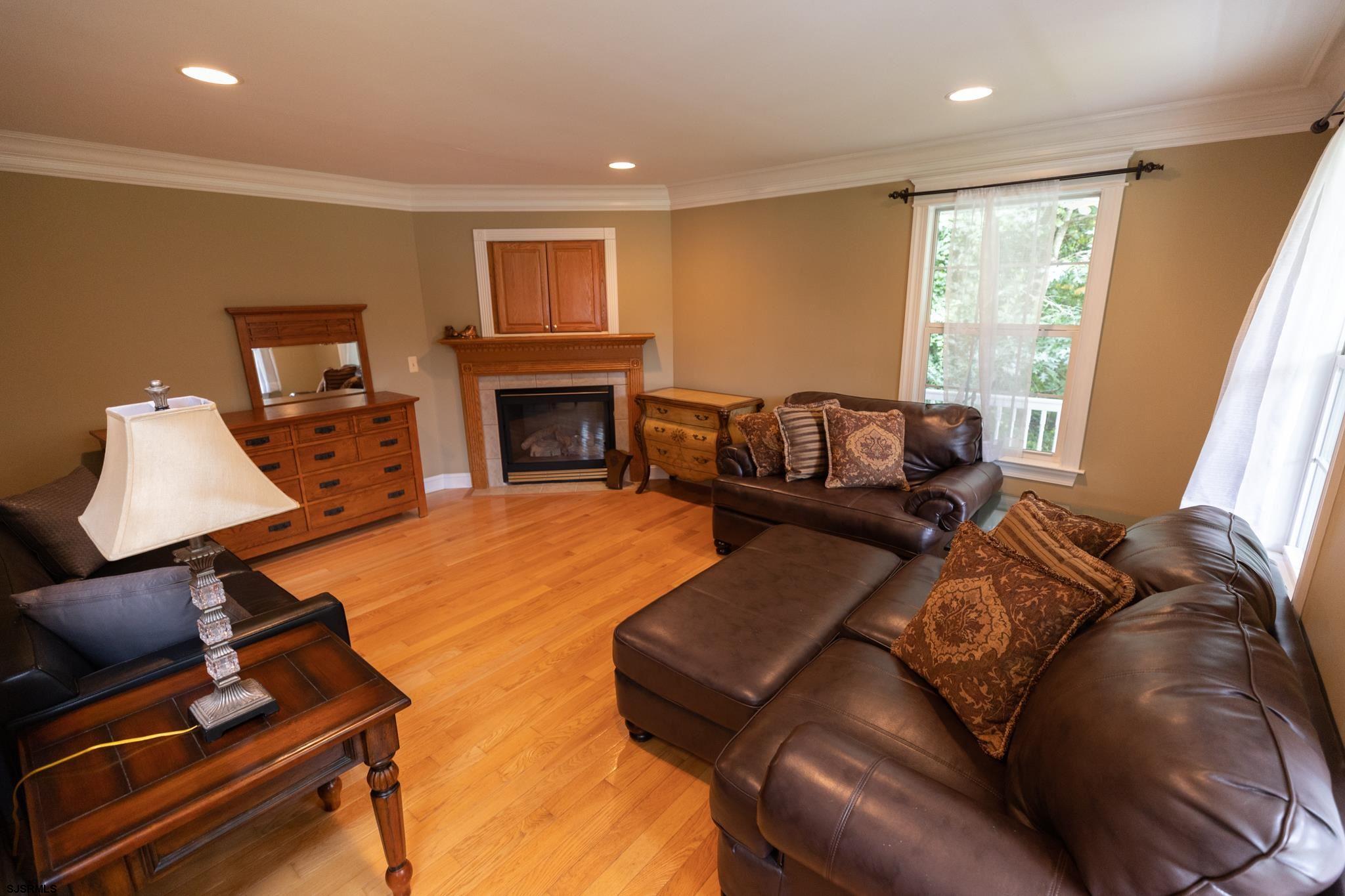 336 Old New York Road Port Republic, NJ 08241 - Photo 6 of 42 a living room with furniture fireplace and a flat screen tv