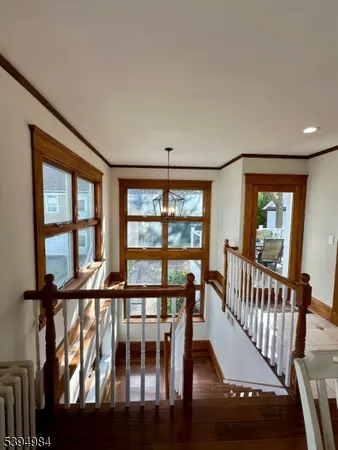 a view of a porch with wooden floor