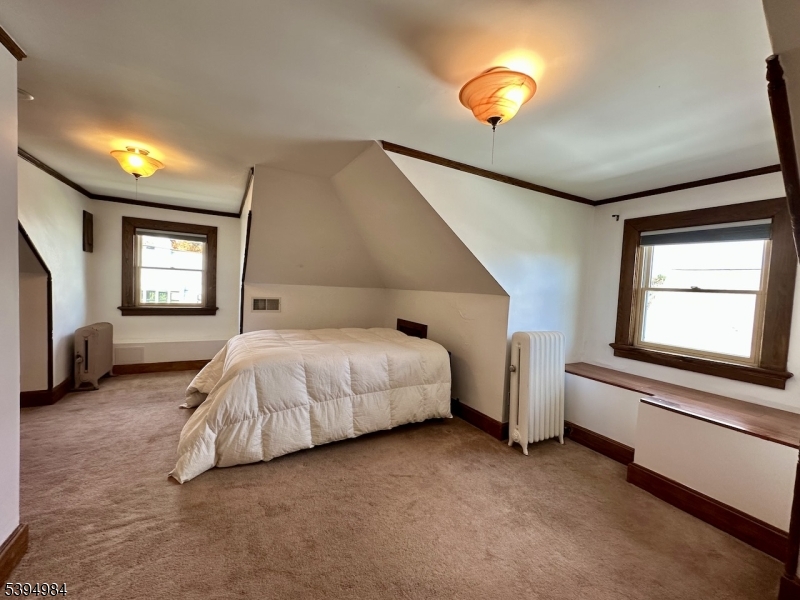 12 Maple Avenue Madison, NJ 07940 - Photo 29 of 39 a spacious bedroom with a bed and window