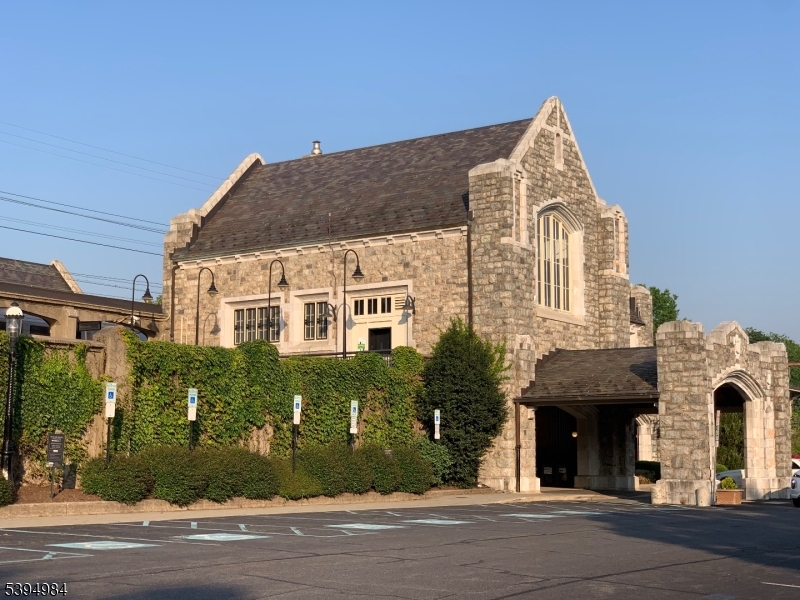 12 Maple Avenue Madison, NJ 07940 - Photo 38 of 39 a view of a brick house with a yard and large tree