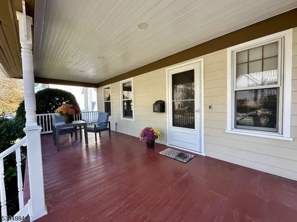 a view of livingroom with furniture and hardwood floor