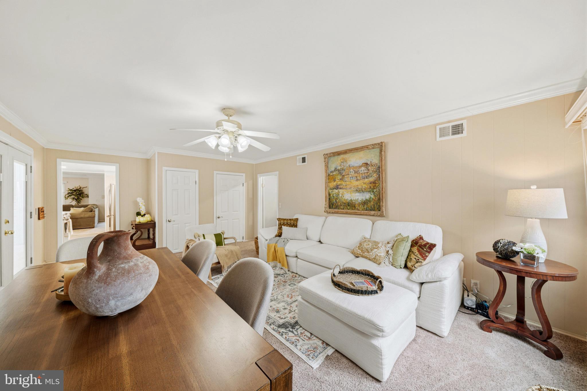 14601 Deerhurst Terrace Silver Spring, MD 20906 - Photo 28 of 51 a living room with furniture and a chandelier