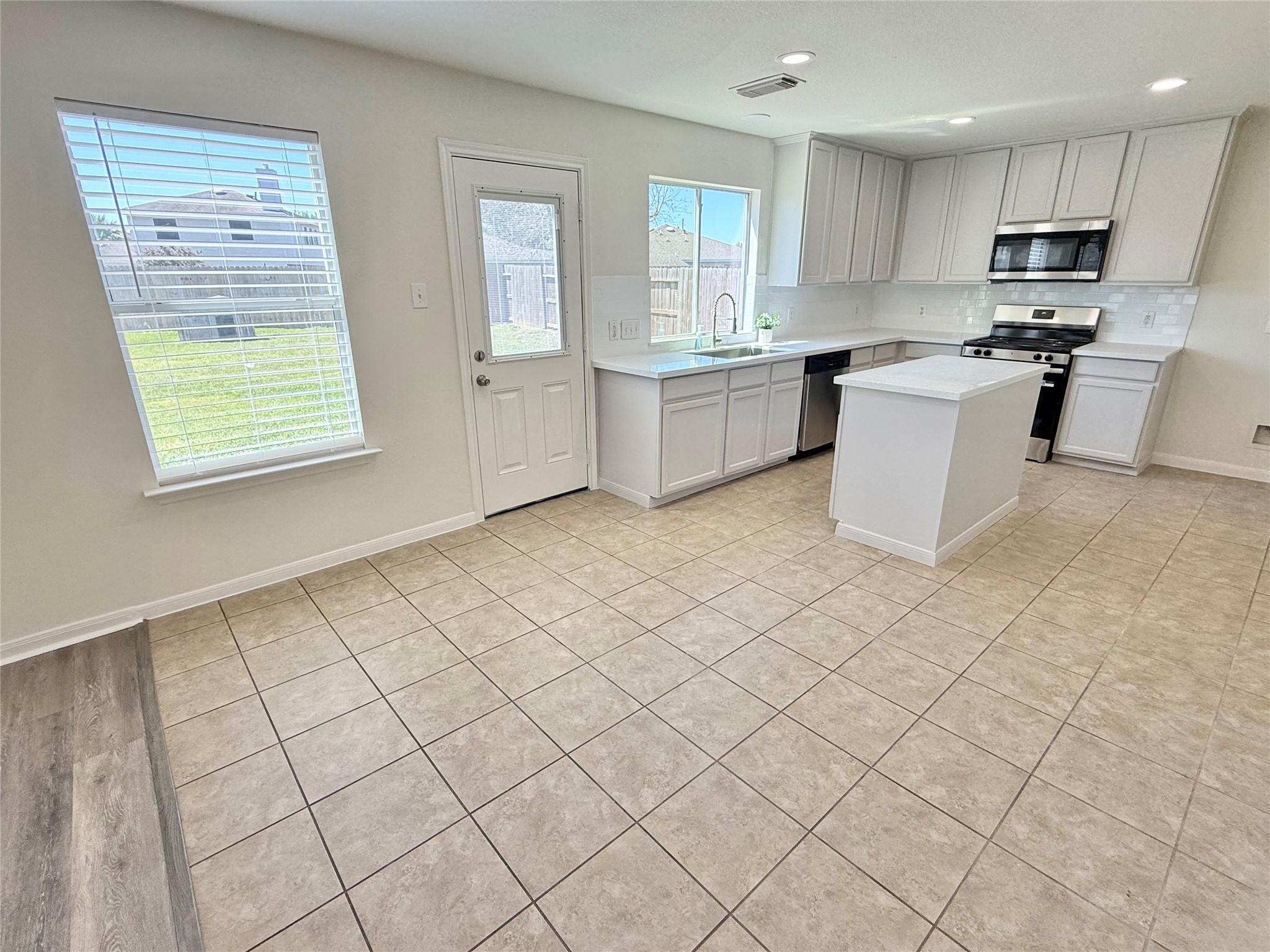 3430 Falcon Trail Court Spring, TX 77373 - Photo 9 of 31 This kitchen includes an island with cabinets, perfect for storing your kitchen appliances.