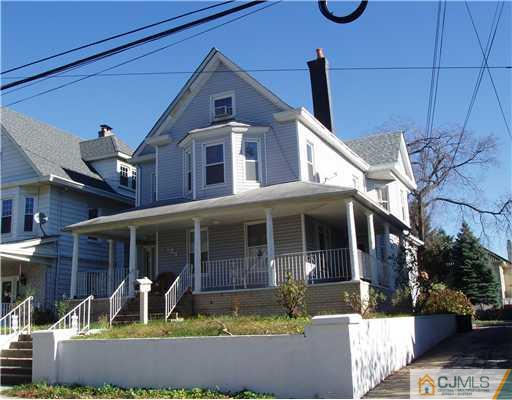 154 Rector Street Perth Amboy, NJ 08861 - Photo 1 of 1 a front view of a house with a yard balcony