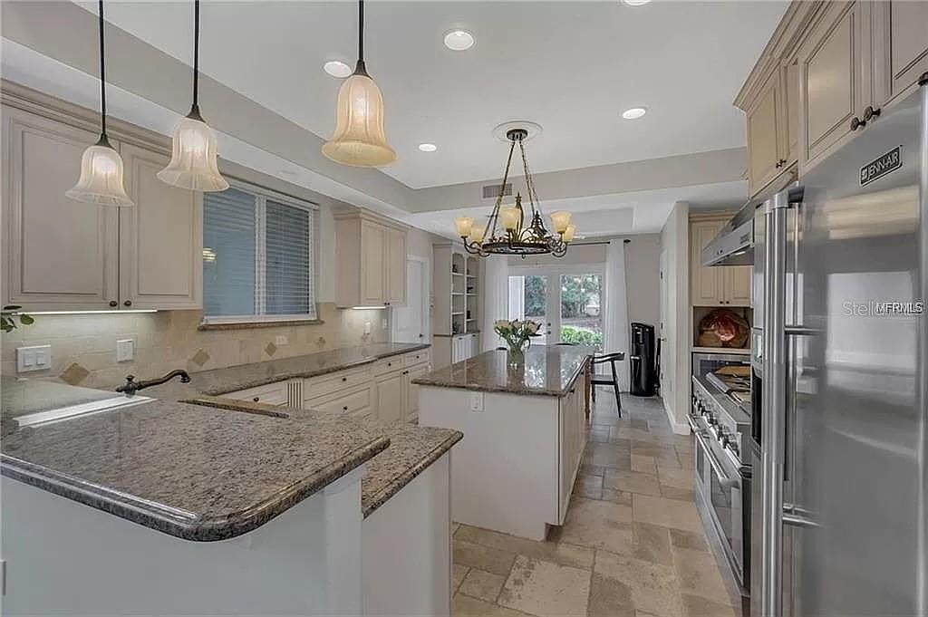 5526 Tiny Road Winter Garden, FL 34787 - Photo 11 of 39 a kitchen with sink cabinets and refrigerator