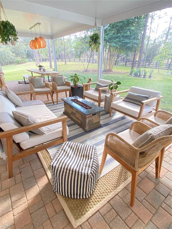 5526 Tiny Road Winter Garden, FL 34787 - Photo 21 of 39 an outdoor sitting area with couch and chairs