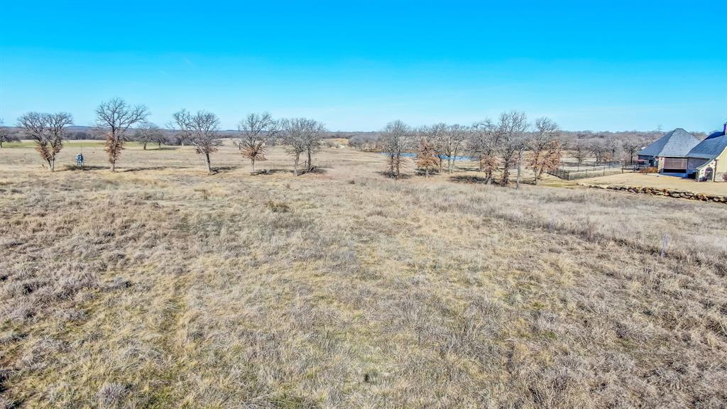 28 Ballpark Way Jacksboro, TX 76458 - Photo 9 of 14 a view of a dry yard with trees