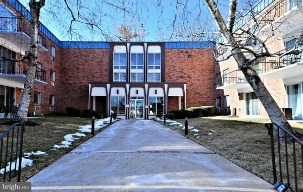 a view of a brick building with many windows