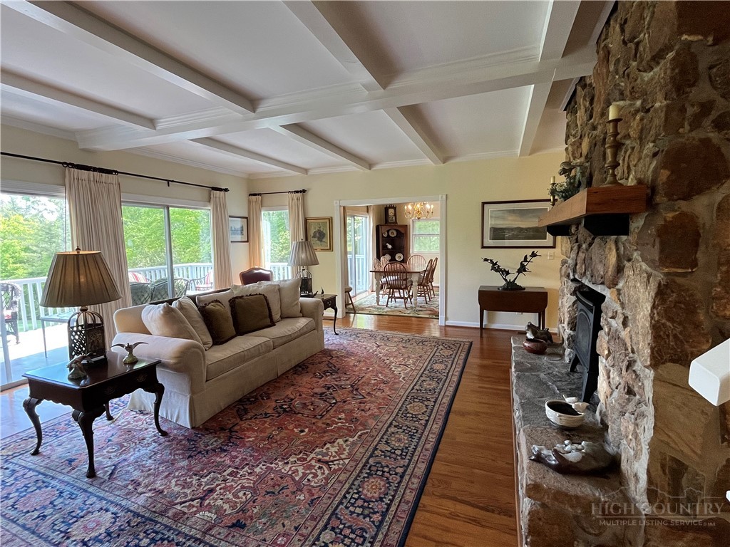 638 Ridge Road Glade Valley, NC 28627 - Photo 2 of 44 a living room with furniture and a fireplace