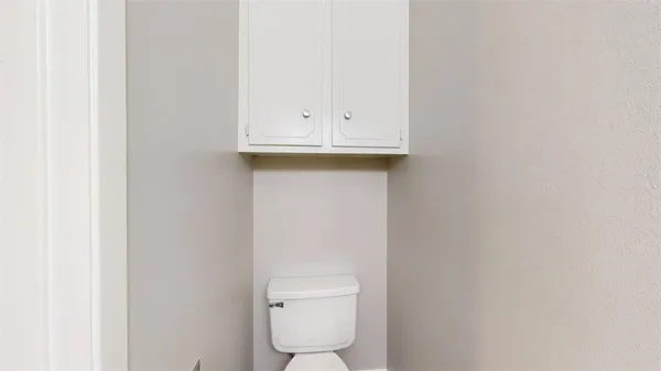a bathroom with a toilet and a sink