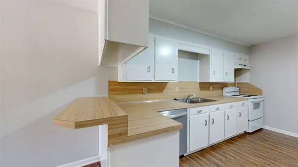 a kitchen with a sink and cabinets