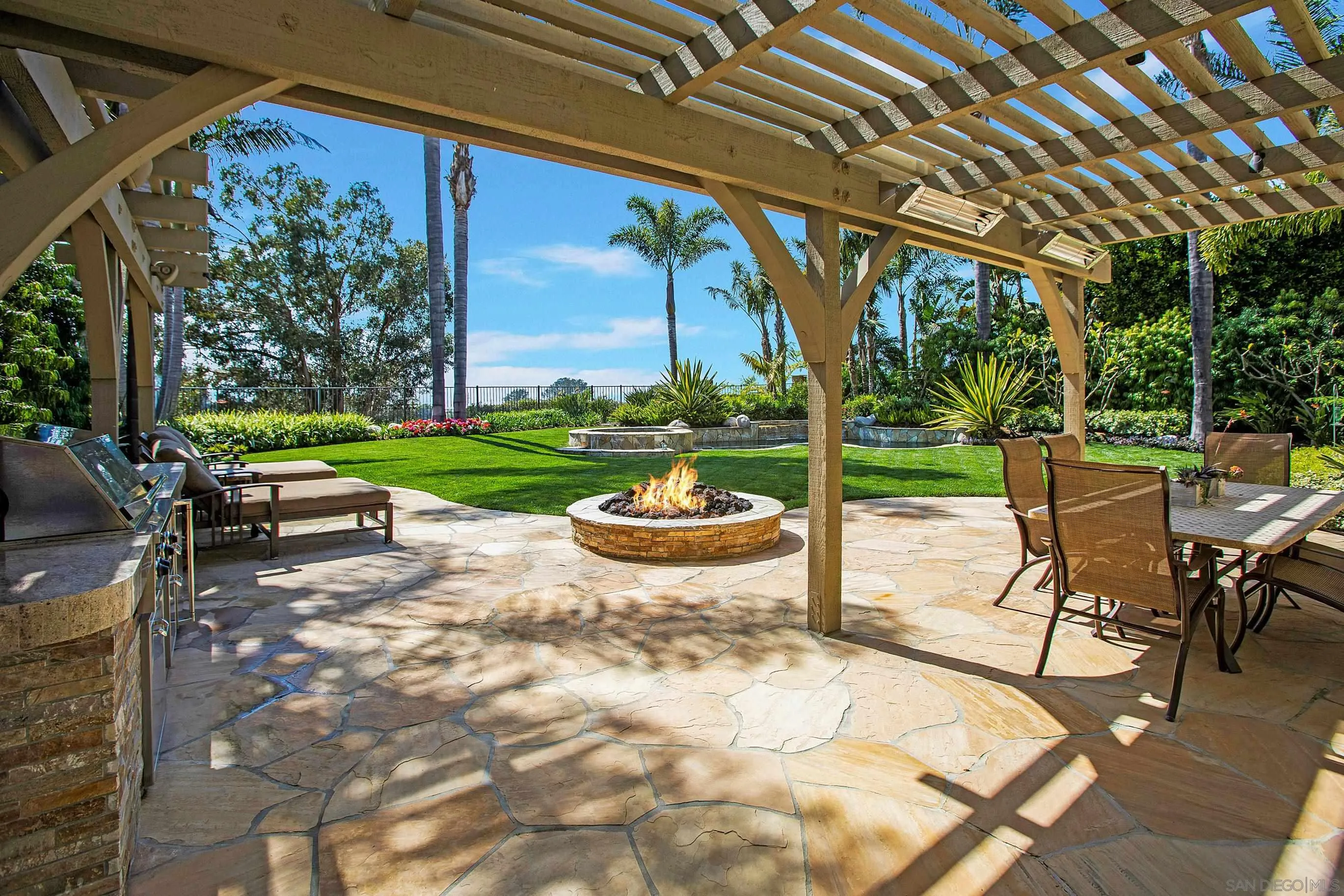 562 Shasta Drive Encinitas, CA 92024 - Photo 2 of 59 a view of a patio with table and chairs and potted plants