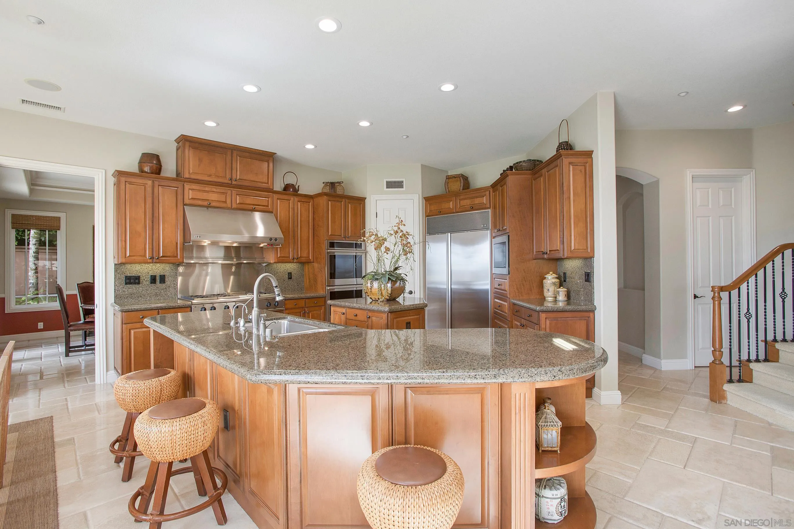 562 Shasta Drive Encinitas, CA 92024 - Photo 21 of 59 a kitchen with stainless steel appliances granite countertop a sink a stove and a refrigerator