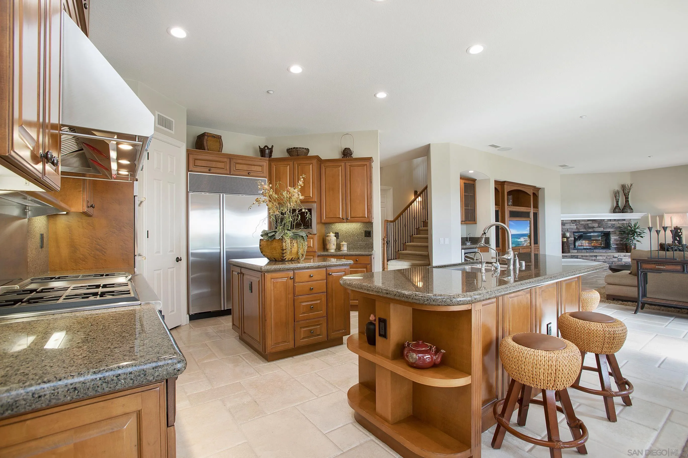 562 Shasta Drive Encinitas, CA 92024 - Photo 25 of 59 a kitchen with stainless steel appliances granite countertop a stove and a refrigerator
