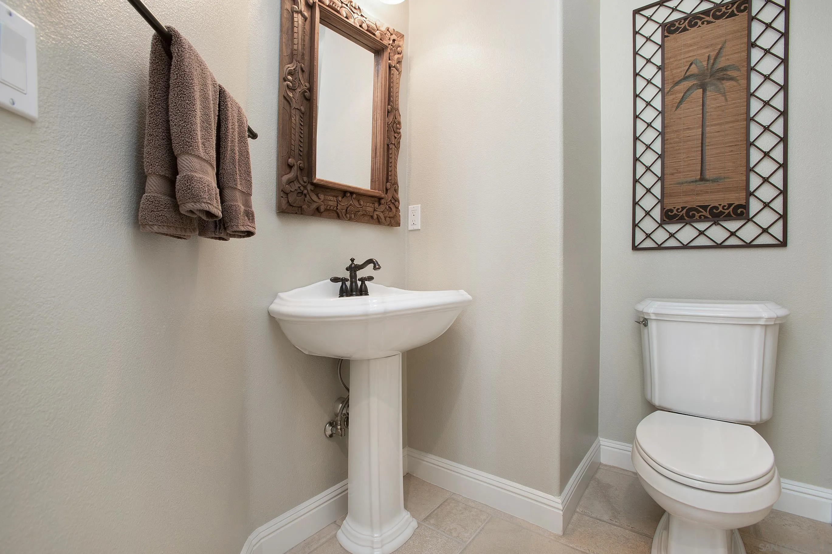 562 Shasta Drive Encinitas, CA 92024 - Photo 29 of 59 a bathroom with a toilet sink and mirror