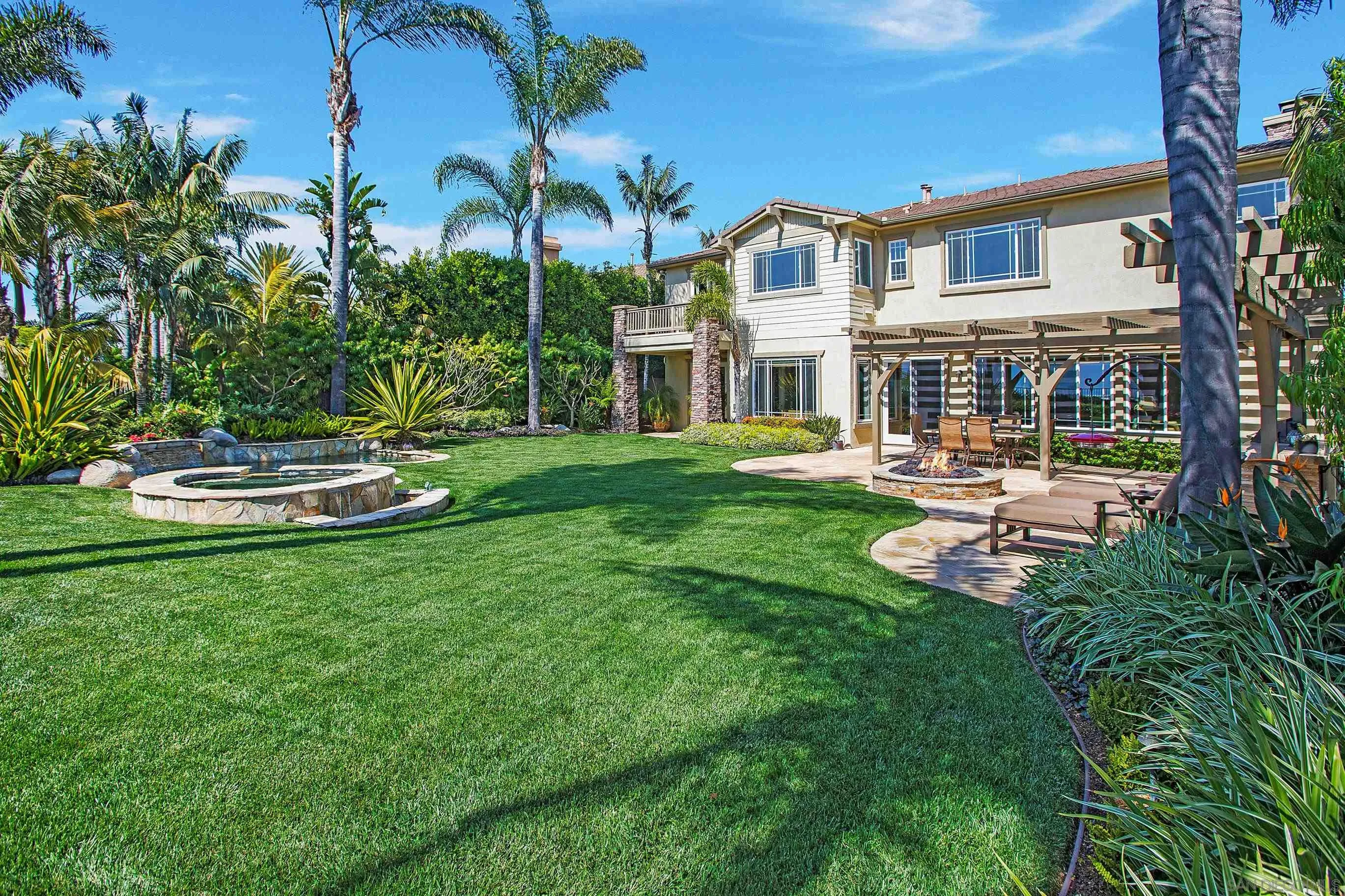 562 Shasta Drive Encinitas, CA 92024 - Photo 3 of 59 a front view of a house with a yard table and chairs