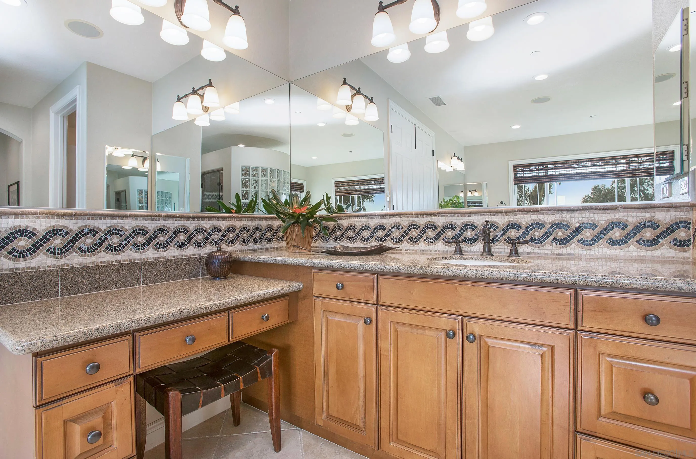 562 Shasta Drive Encinitas, CA 92024 - Photo 40 of 59 a bathroom with a sink and a mirror
