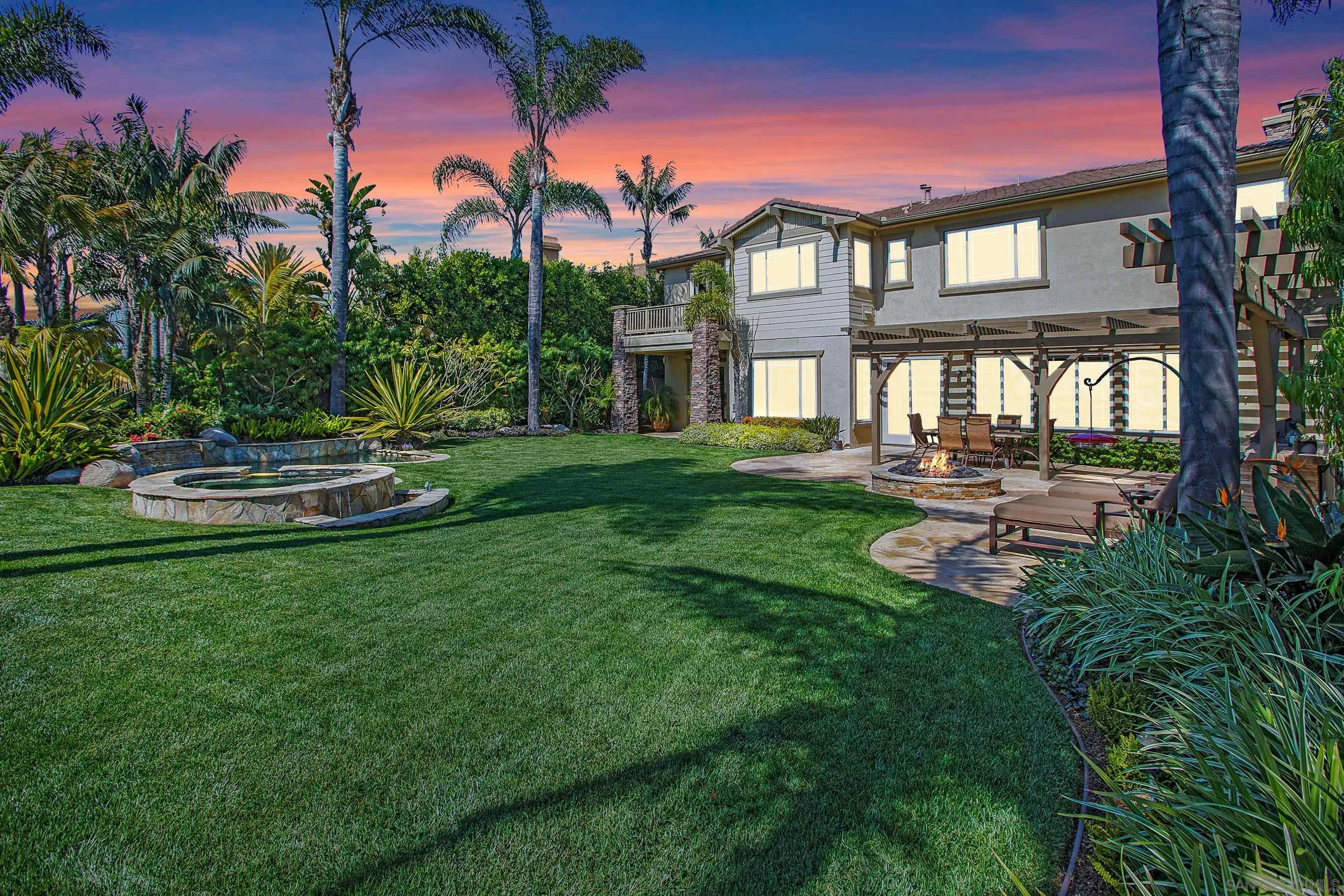 562 Shasta Drive Encinitas, CA 92024 - Photo 51 of 59 a front view of a house with a yard table and chairs