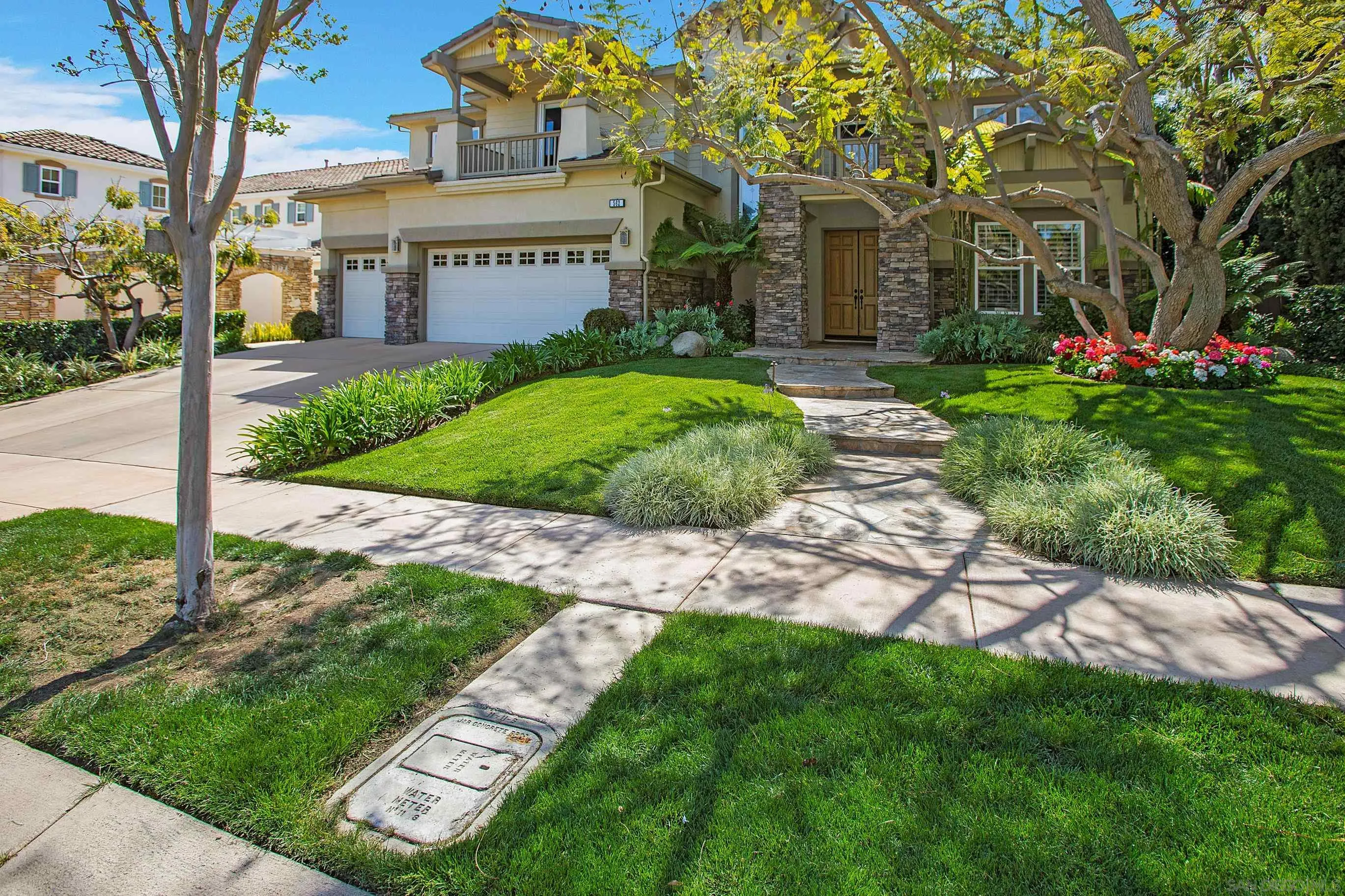 562 Shasta Drive Encinitas, CA 92024 - Photo 7 of 59 a front view of a house with a garden and trees