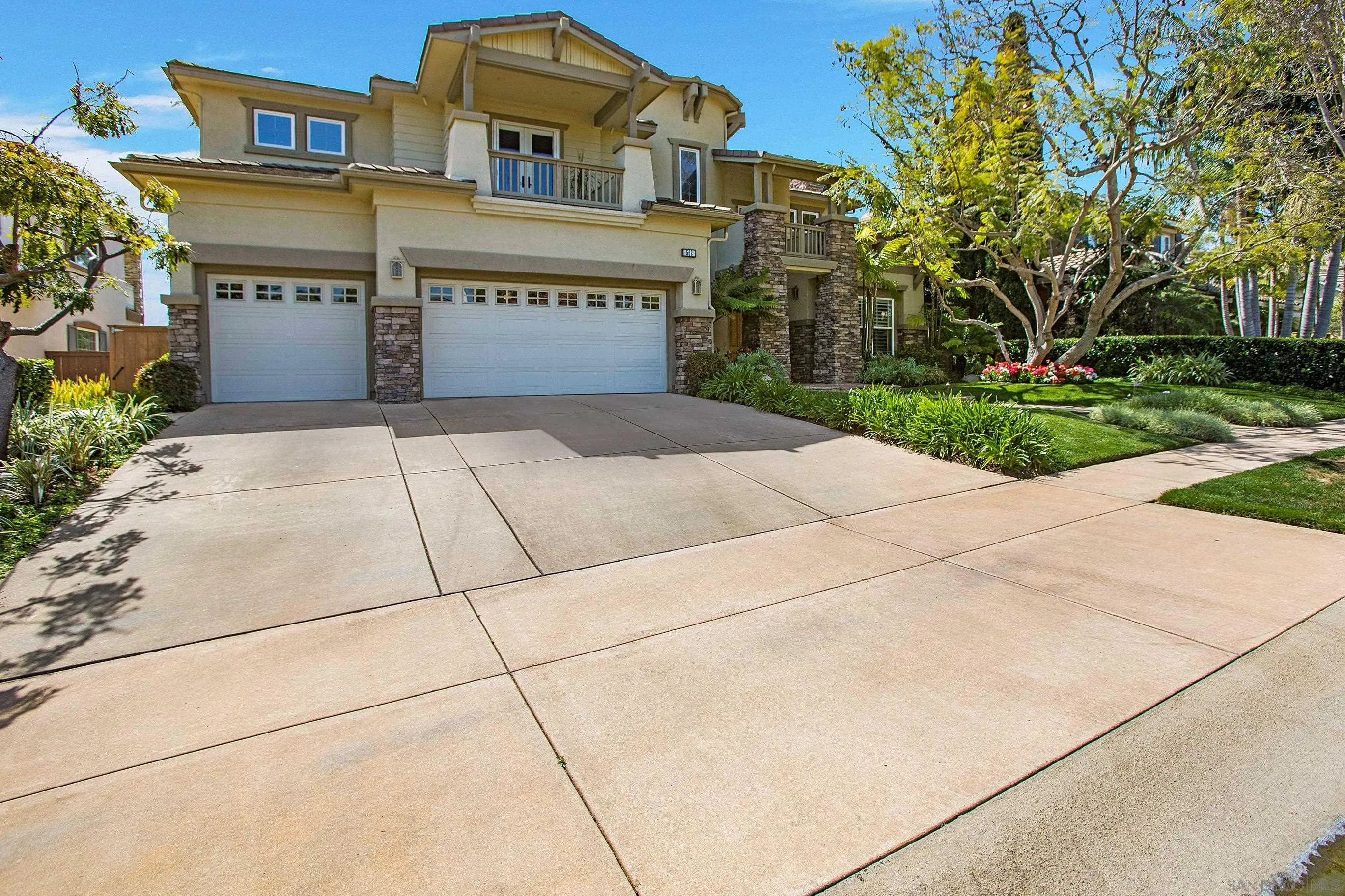 562 Shasta Drive Encinitas, CA 92024 - Photo 8 of 59 a front view of a building with a garden and garage