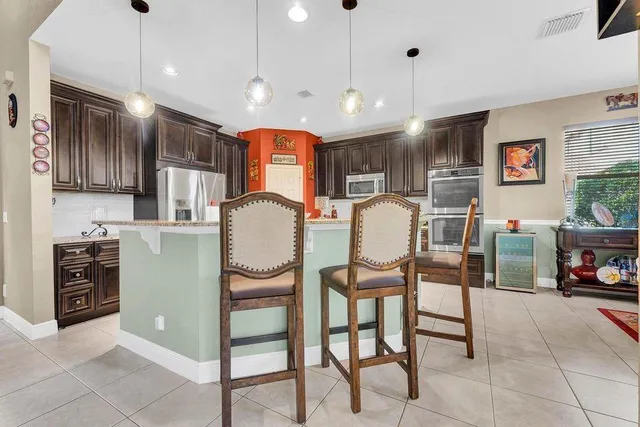 $879,999 | 112 Ibisca Terrace, Royal Palm Beach, FL 33411