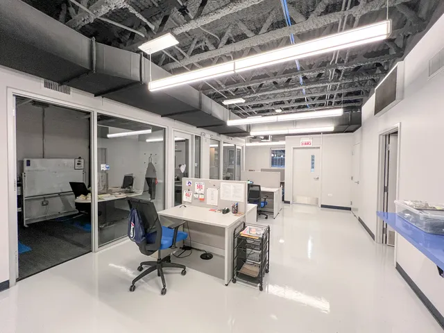 a view of living room with furniture and a kitchen