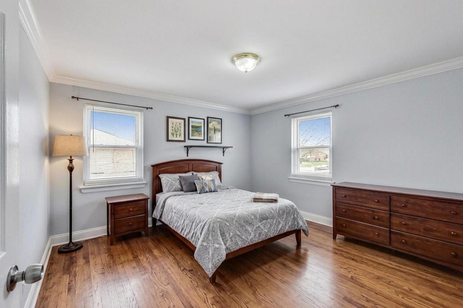 402 North Main Street Mount Prospect, IL 60056 - Photo 10 of 19 a bedroom with a bed and a window