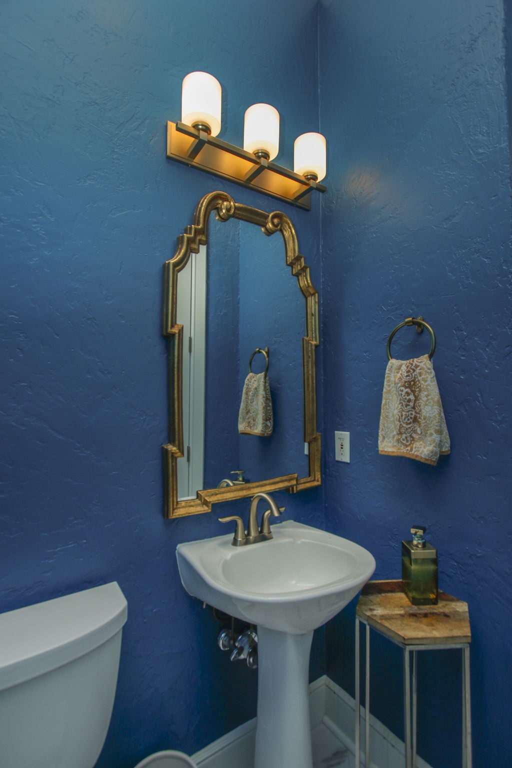 16610 Manningtree Lane Spring, TX 77379 - Photo 32 of 50 The first floor powder bath is a beautiful blue with marble look porcelain tile floors and is located just off the entry.