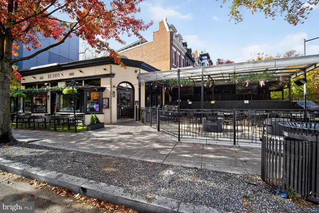 a view of a door with wooden bench