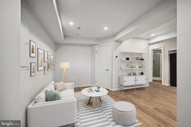 a living room with furniture and a table