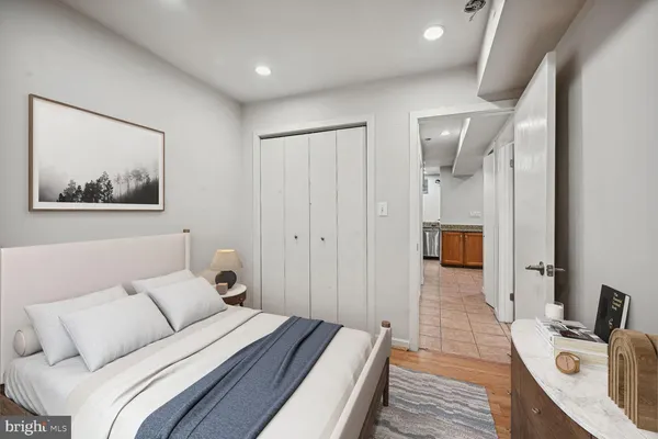 a bed room with a bed and a view of bathroom