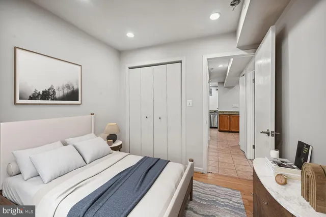 a bed room with a bed and a view of bathroom