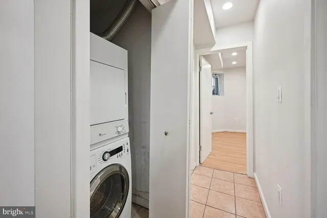 a view of a hallway with washer and dryer