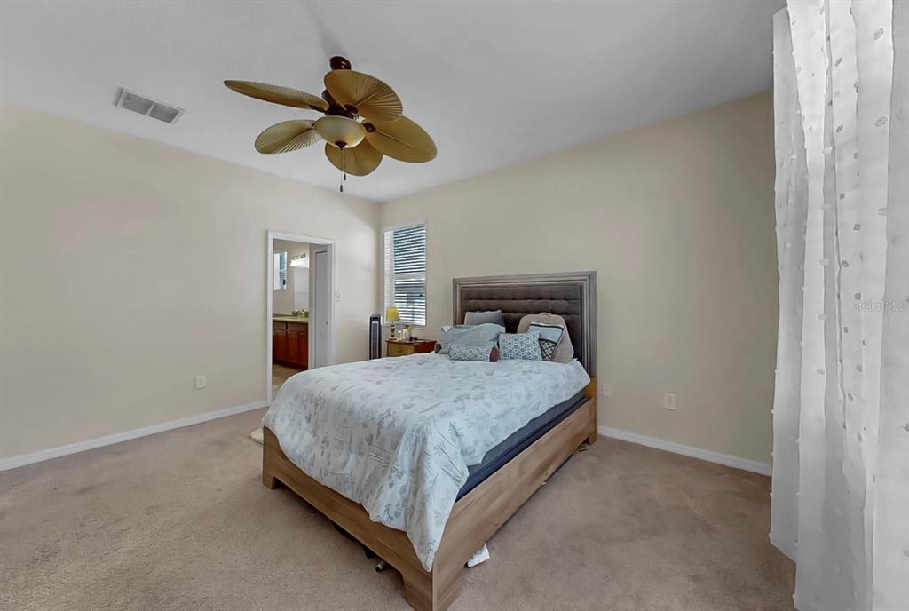 2408 Nighthawk Landing Court Ruskin, FL 33570 - Photo 22 of 50 a bedroom with a bed and window