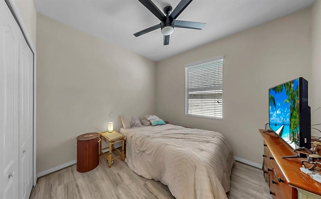 2408 Nighthawk Landing Court Ruskin, FL 33570 - Photo 27 of 50 a bedroom with a bed and a flat screen tv