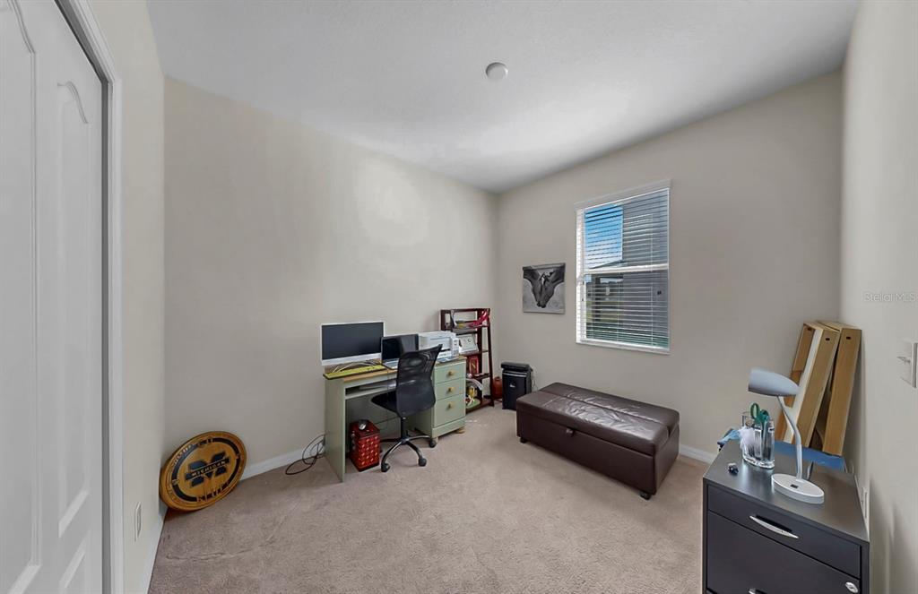 2408 Nighthawk Landing Court Ruskin, FL 33570 - Photo 30 of 50 a view of a workspace with furniture and a window