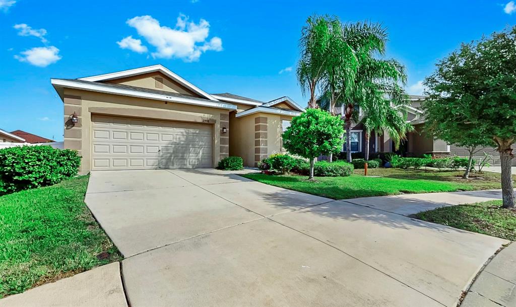 2408 Nighthawk Landing Court Ruskin, FL 33570 - Photo 34 of 50 a front view of a house with a yard