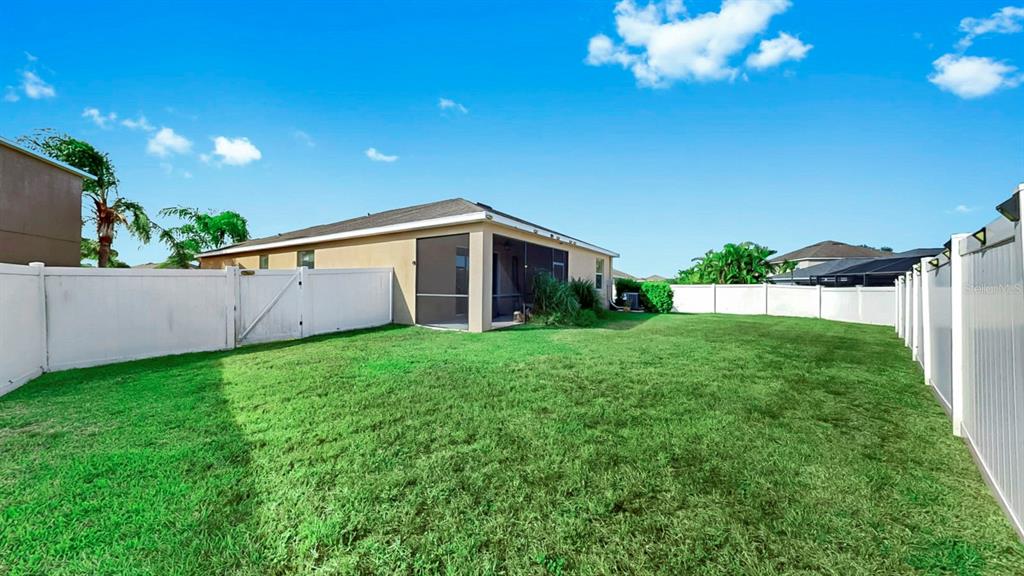 2408 Nighthawk Landing Court Ruskin, FL 33570 - Photo 35 of 50 a view of a house with a backyard