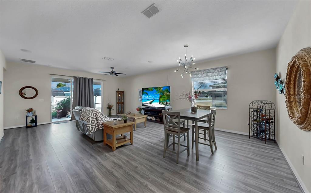 2408 Nighthawk Landing Court Ruskin, FL 33570 - Photo 4 of 50 a living room with furniture and a wooden floor