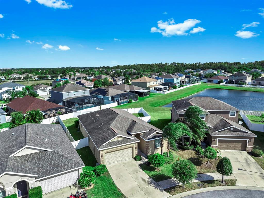 2408 Nighthawk Landing Court Ruskin, FL 33570 - Photo 41 of 50 an aerial view of a house with a garden and lake view