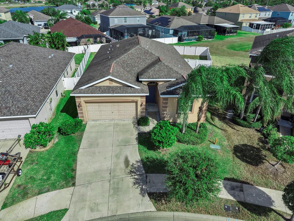 2408 Nighthawk Landing Court Ruskin, FL 33570 - Photo 45 of 50 a aerial view of a house with a yard and plants