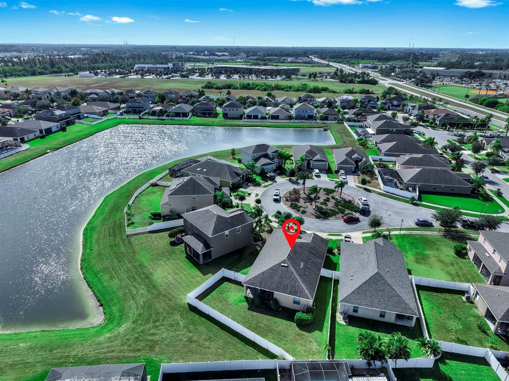 2408 Nighthawk Landing Court Ruskin, FL 33570 - Photo 47 of 50 an aerial view of a house with a garden and lake view