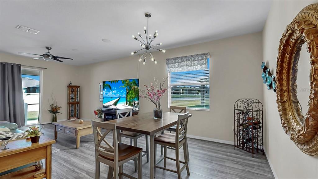 2408 Nighthawk Landing Court Ruskin, FL 33570 - Photo 6 of 50 a view of a dining room with furniture window and outside view