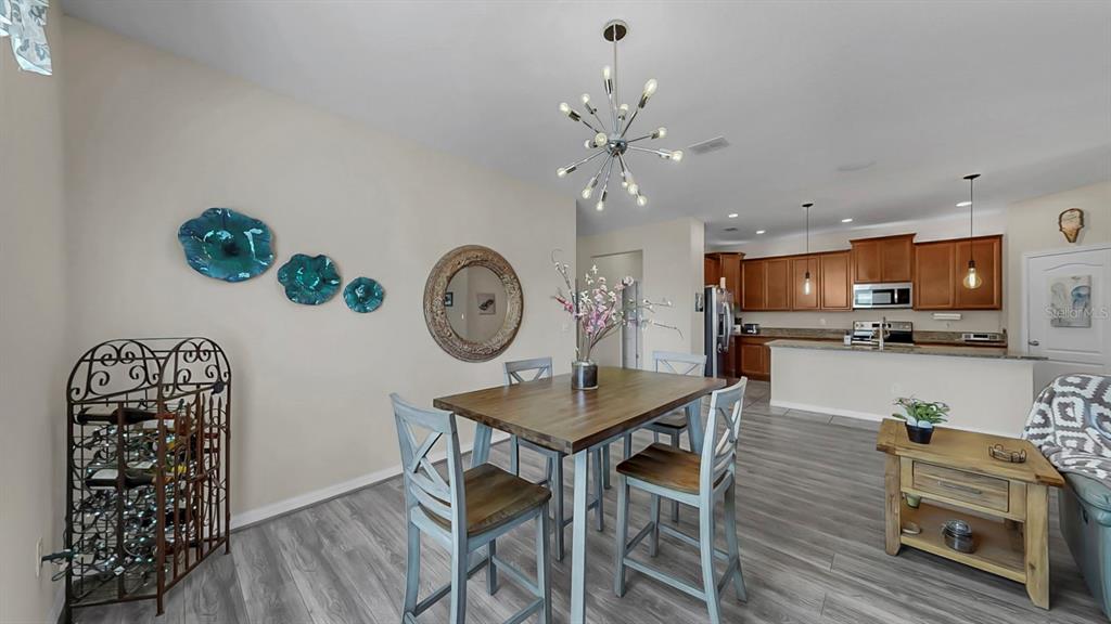 2408 Nighthawk Landing Court Ruskin, FL 33570 - Photo 7 of 50 a living room with furniture and kitchen view